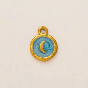 Detailed macro view of 18K gold-plated sea turtle pendant with blue enamel crescent moon