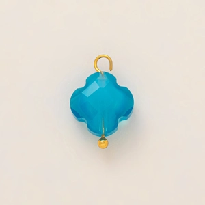 Detail of blue faceted clover pendant with 18k gold-plated stainless steel hook