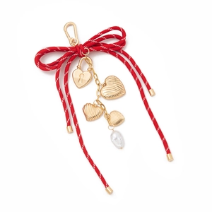 DIY bow keychain with 18K gold plated heart charms and a white baroque pearl pendant
