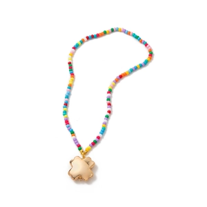 Handmade colorful beaded necklace featuring a large polished golden clover leaf pendant