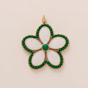 Golden camellia flower pendant featuring white petals and green zircon stone accents