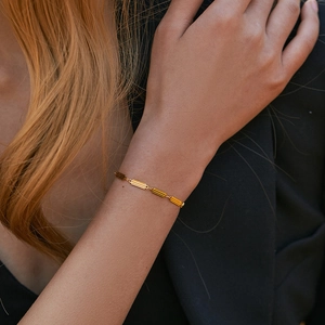French vintage 18K gold plated striped link bracelet shown on a model wrist
