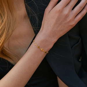 18K gold plated brass bracelet with hollow heart charms and S925 engraved detailing