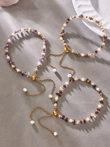 Detail of adjustable pearl and gemstone bracelets with gold beads and drawstrings