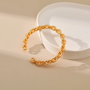 French style thick chain open bangle in gold finish with minimalist polished metal texture
