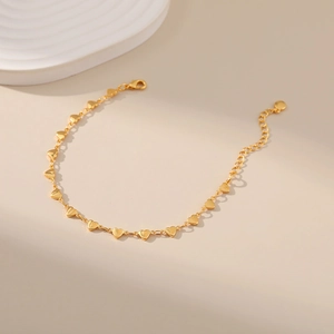 Close-up of 18K gold-plated heart chain bracelet with lobster clasp and extension chain