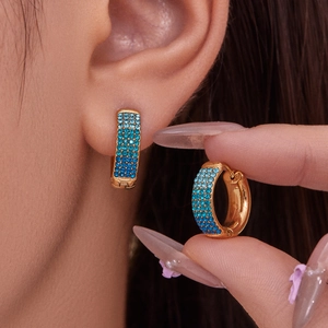 Elegant gold hoop earrings with gradient blue pave zircons for a luxury fashion look
