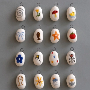Set of 16 ivory ceramic DIY charms with hand-painted patterns and silver metal rings