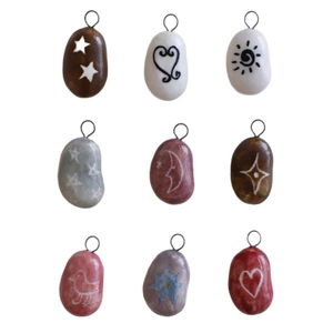 Set of 9 colorful hand-painted natural stone pendants with assorted artistic symbols