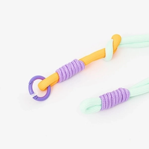 Detail of mint green braided lanyard with orange and purple accents and ring clasp