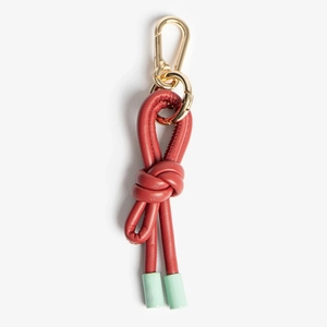 Detail of red leather rope knot keychain with mint green tips and gold lobster clasp