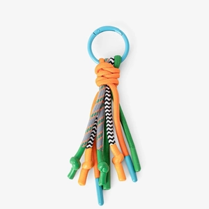 Macro detail of vibrant woven rope keychain with blue spring ring and cord knots