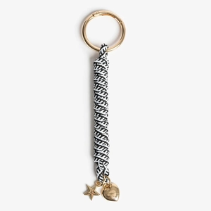 Detail of hand-woven black and white lanyard with golden star and heart pendants