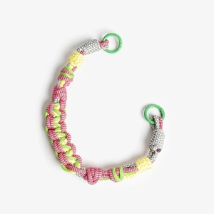 Detail of colorful handmade braided rope strap with bright green round metal spring clasps