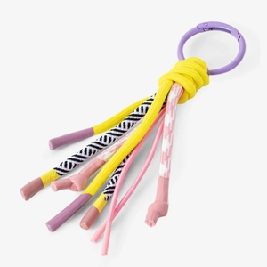Detail of colorful braided rope keychain with purple carabiner and woven cord textures