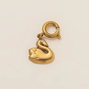 Detailed view of 18K gold plated swan pendant with a sparkling crystal and bolt ring clasp