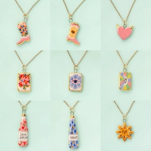 Set of nine colorful ceramic charms with hand-painted mermaid boots, hearts, and sun designs
