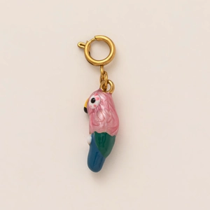 Detailed close-up of a colorful parrot charm with pink enamel and a gold spring clasp