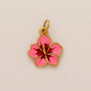 Detail of pink enamel flower pendant with golden metal border and 18K gold plating
