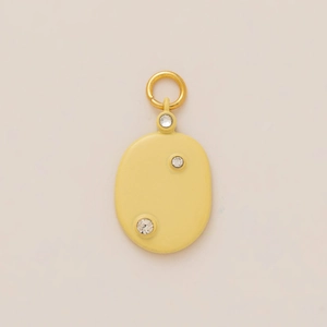 Chic oval pendant with light yellow enamel finish and three sparkling zircon accents