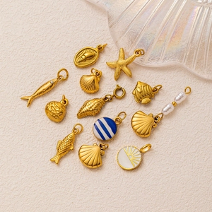 Set of 12 ocean-themed 18K gold plated stainless steel charms including starfish and shells