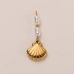 Detailed view of ocean shell pendant with double white pearls and 18K gold plated metal