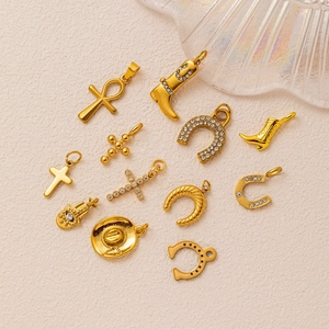 Vintage gold multi-element charm set featuring cowboy boots, crosses, and hamsa charms