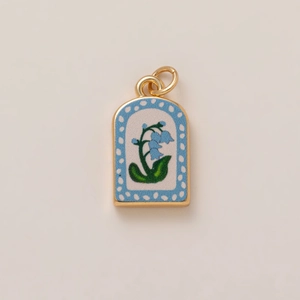 Charming lily of the valley enamel pendant with blue flowers in a golden arch frame