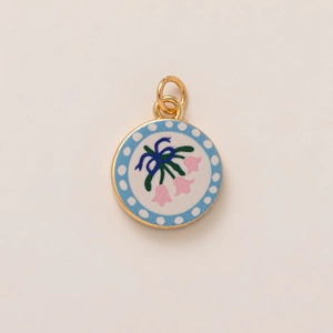 Enamel pendant featuring blue butterfly bow and pink floral pattern with gold finish