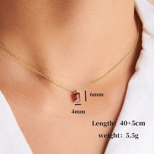 18K gold plated titanium necklace with rectangular red zircon birthstone pendant on model