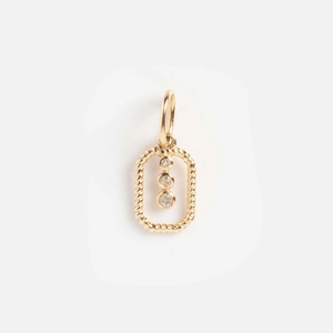 Detail of 14k gold-plated rectangular pendant with three sparkling zircons and twisted rope edges