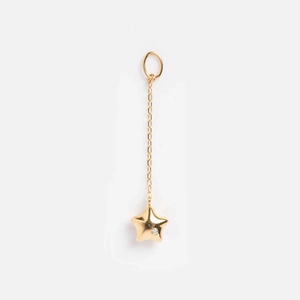 Detailed view of a 14k gold-plated star pendant with a sparkling zircon inlay detail