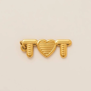 Detailed close-up of golden letter T and heart pendant with refined vertical texture