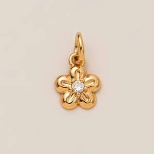 Golden five-petal flower pendant with a sparkling zircon center and closed ring clasp
