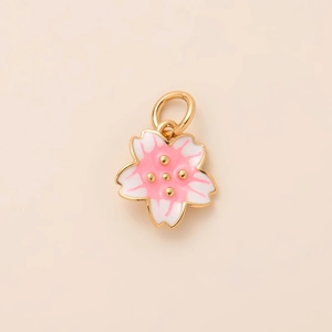 Detailed view of a gold-plated sakura flower pendant with pink and white enamel petals