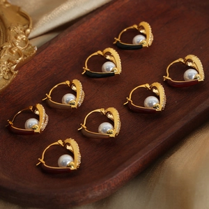 Elegant heart-shaped pearl earrings with gold plating and cubic zirconia accents