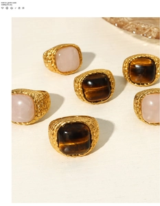 Detailed view of British style titanium rings with woven texture and natural square stones