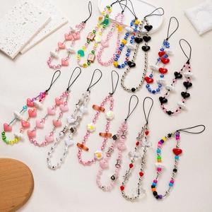 Colorful beaded phone charms featuring heart bear and flower patterns in multiple designs