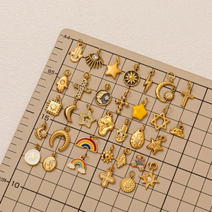 Gold celestial charms set with sun moon star and evil eye for necklace making