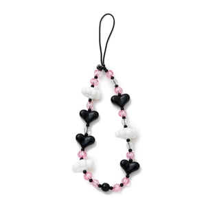 Detailed view of handmade beaded phone strap with black hearts and white clouds charms