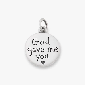 Macro view of stainless steel pendant featuring engraved 'God gave me you' text and heart