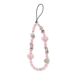 Detail of pink heart and silver dice beads on a handmade phone strap charm
