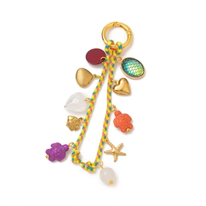 Detailed view of colorful ocean themed pendant with sea turtle and shell charms