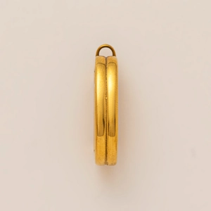 Detail view of 18K gold plated stainless steel round pendant with side groove and ring