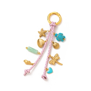 Detail of pink woven lanyards with golden shell starfish and turtle charms pendants
