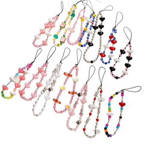 Colorful handmade beaded phone straps with hearts, clouds and smiley faces on white backdrop