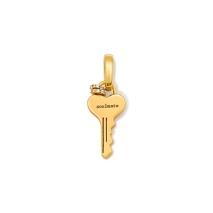 Detailed view of golden heart-shaped key pendant engraved with soulmate and zircon