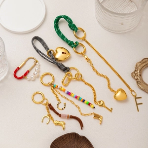 Colorful handmade braided keychain set with gold charms and heart pendants for bags