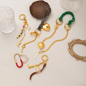 Handmade woven keychain set with colorful beads, heart charms, and golden metal chains