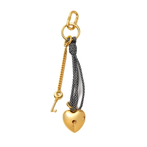 Braided black and white rope keychain with gold heart pendant and key charm on white background